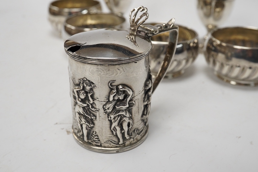 Assorted small silver including a cigarette case, set of four Victorian salts by Thomas Bradbury & Sons, London, 1878, a sterling cow creamer and three condiments. Condition - fair to good